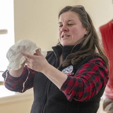 Anne Clothier, Saratoga County assistant to the historian, shows attendees the pattern and style of stitching on a colonial women’s cap during a historical sewing session for reenactors and volunteers for the Saratoga 250th events at Brookside Museum in Ballston Spa on Saturday.