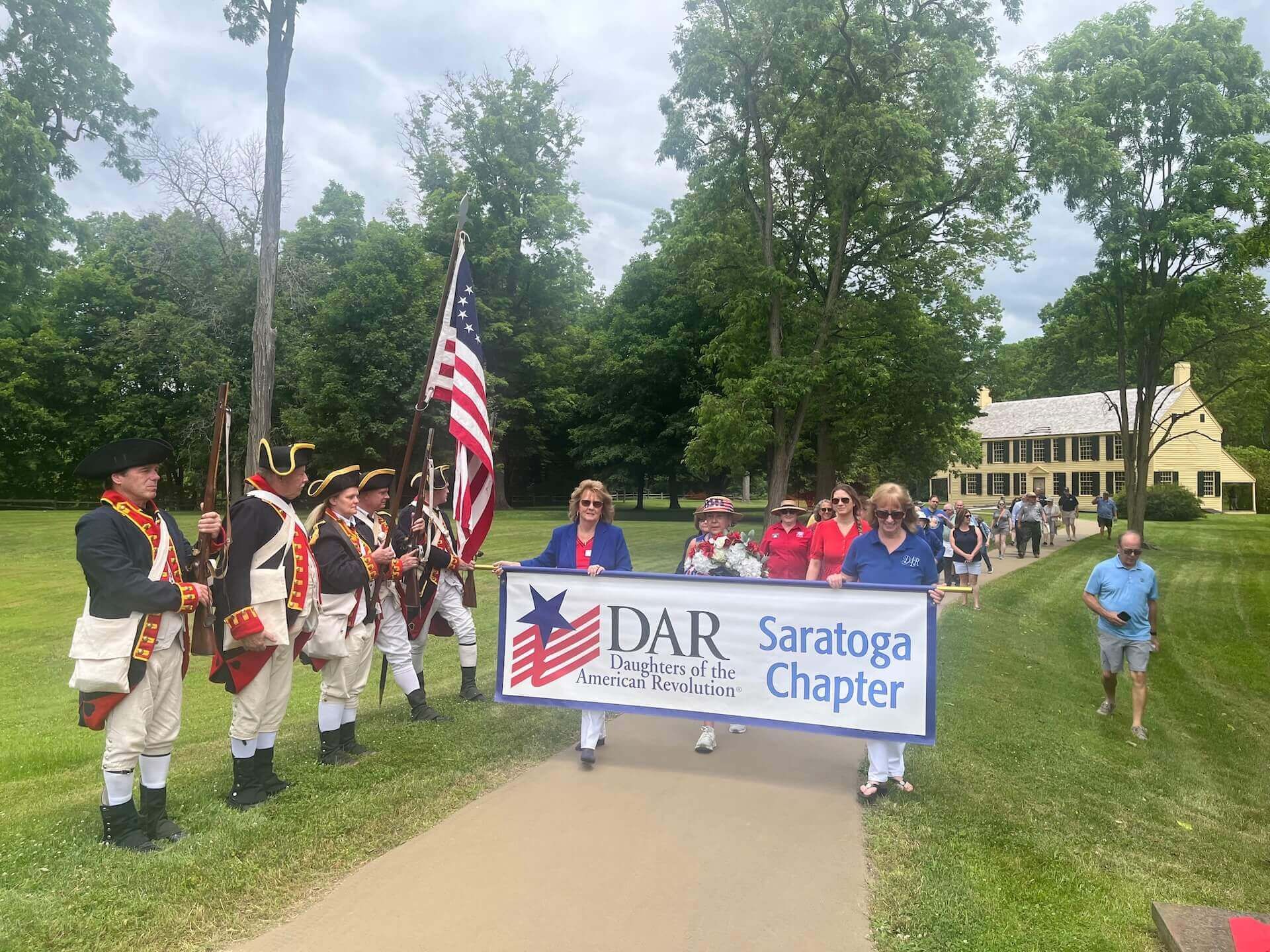 Members of the Sons of the American Revolution and Daughters of the American Revolution gather at the Schuyler House for a wreath-laying ceremony honoring Lafayette’s legacy.