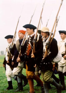 Revolutionary War reenactors marching