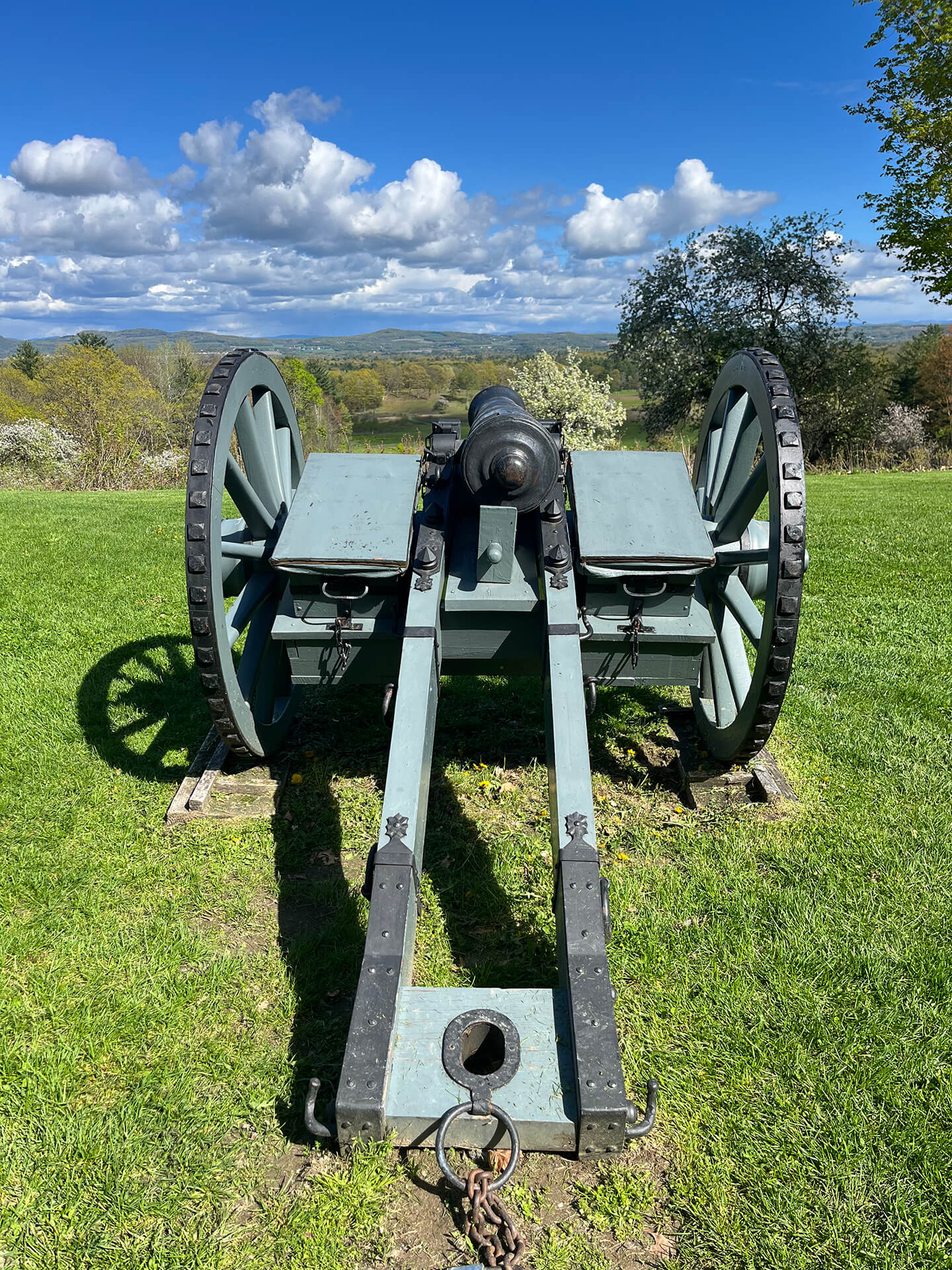 Historical cannon overlooking a valley and distant mountains