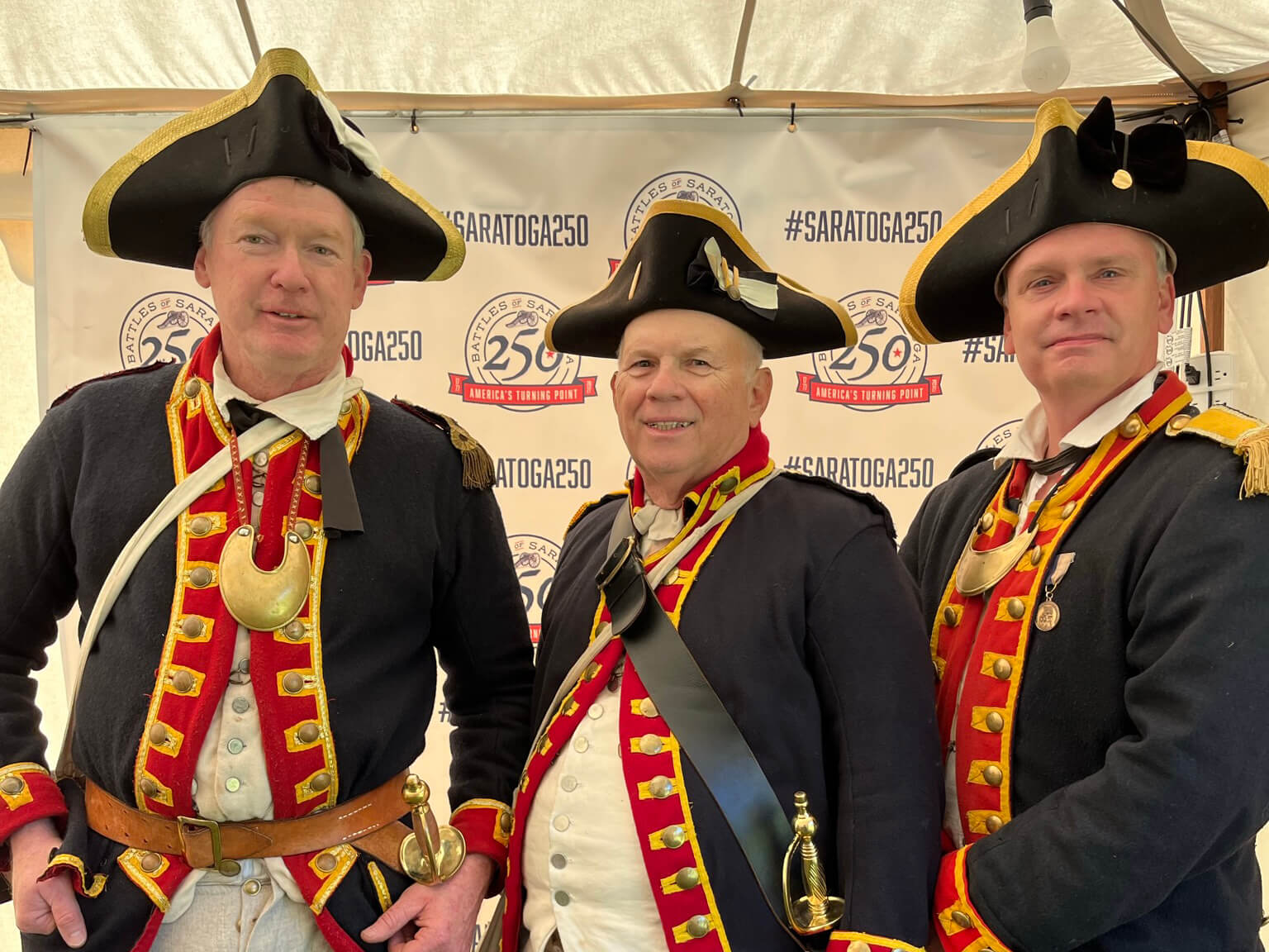 Three men dressed as Revolutionary War soldiers