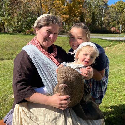 Revolutionary War reenactors - a woman and two children